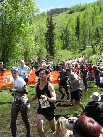 Lapping a very muddy person on Lap 3 of the Mud Run.