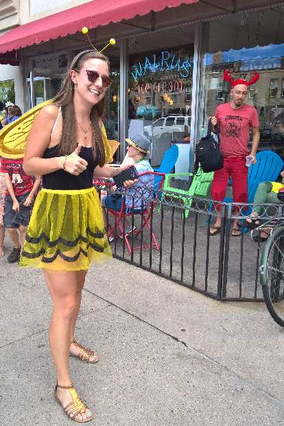 Olivia in a bee costume in front of Walrus Ice Cream. Olivia in a bee costume in front of Walrus Ice Cream.