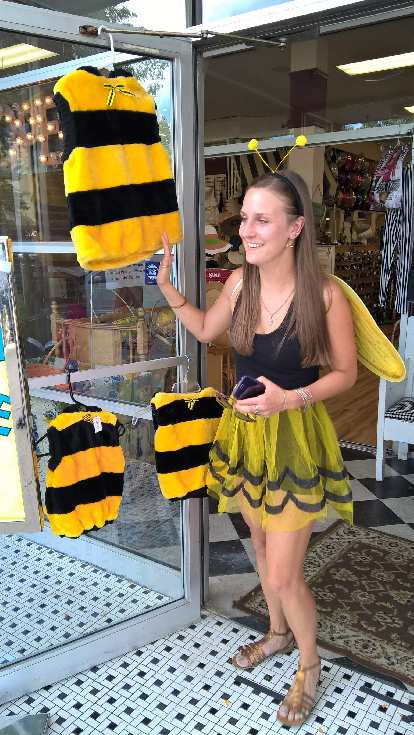Olivia with other bee costumes at a shop along College Ave. Olivia with other bee costumes at a shop along College Ave.