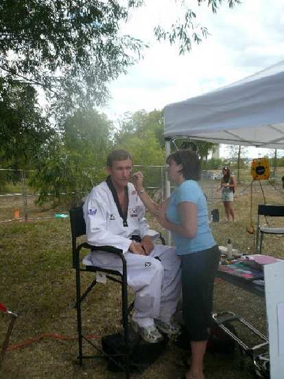 Tim getting face-painted. Tim getting face-painted.