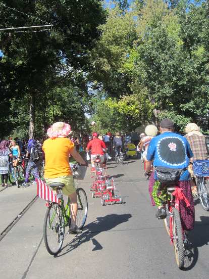 Following a stringed-together line of of tricycles.