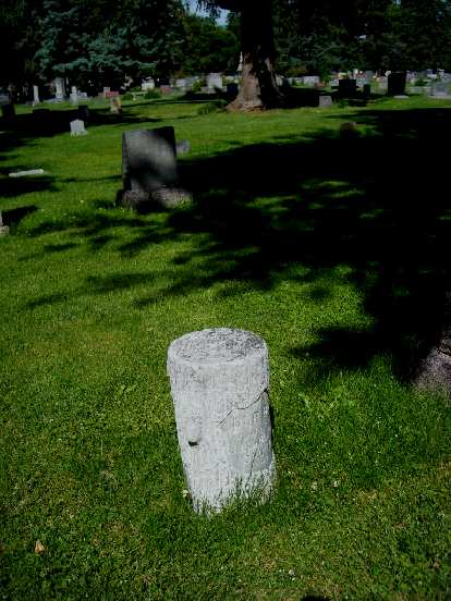 A tombstone in the Grandview Cemetery made from a tree stump. A tombstone in the Grandview Cemetery made from a tree stump.