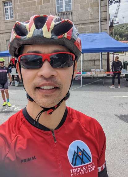 Felix Wong wearing a red Triple Bypass jersey at the second 4 Picos aid station.
