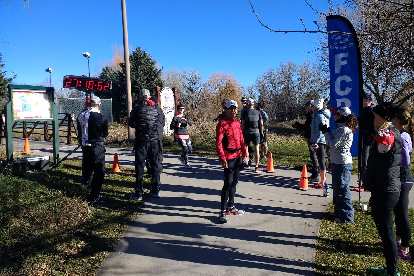 Volunteers and runners at the end of the 2017 Turkey/Donut Predict 5k at Rolland Moore Park.