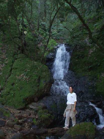 Evelyn in front of another waterfall.