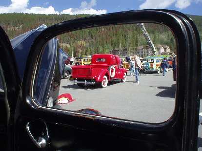 View of another Ford pickup through a door window.