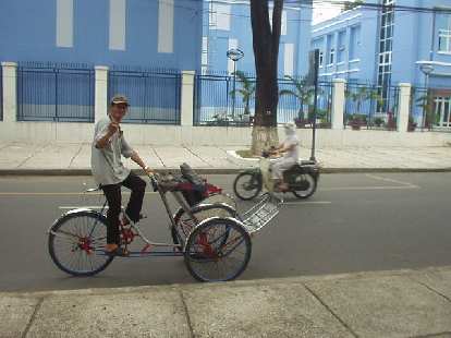 Cyclo guy stalking me by the Reunification Palace in Saigon.