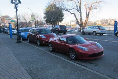 Tesla Roadster and two Nissan Leafs at an EV event near the State Legislature.