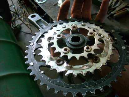 Bruce's managed to "create" this crankset. Note how he had to cut off the spider arms on the middle chainring to get it to work. (29 Dec 2010) Bruce's managed to "create" this crankset. Note how he had to cut off the spider arms on the middle chainring to get it to work.