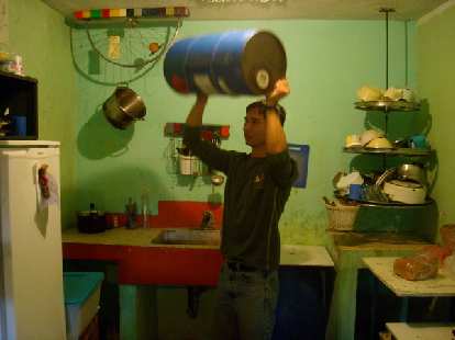 Felix Wong rinsing out a methanol tank that was to be used as an interior drum for the new bici-frijole machine. (31 Dec 2010) Felix Wong rinsing out a methanol tank that was to be used as an interior drum for the new bici-frijole machine.