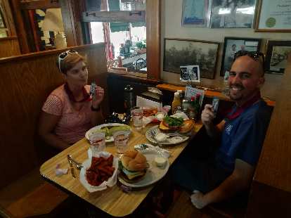 Mel and Manuel eating lunch at the Depot after the 2019 Wabash Trace Trail Marathon.