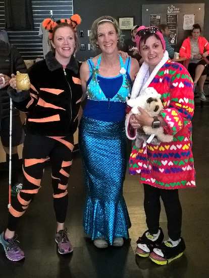 Three great costumes at breakfast after the Nick awards the first place ribbon to Vanessa at the 2015 Warren Park 5k Tortoise &amp; Hare race: Tigger, a mermaid, and a crazy cat woman.