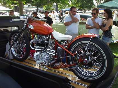An elegant Triumph motorcycle on a pickup bed. An elegant Triumph motorcycle on a pickup bed.