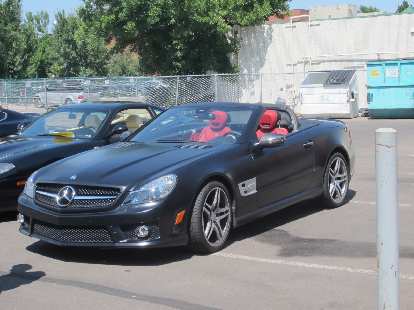 A 2012 Mercedes SL550 in matte black. A 2012 Mercedes SL550 in matte black.