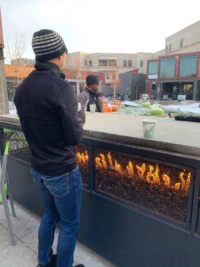 Felix warming up by the fire at the Exchange in Old Town Fort Collins during Winter Bike to Work Day. Photo: Brooke Benson. Felix warming up by the fire at the Exchange in Old Town Fort Collins during Winter Bike to Work Day.