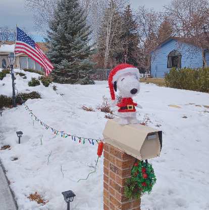 Snoopy dressed up in a Christmas costume on top of a mailbox, as seen while biking back home on Winter Bike to Work Day. Snoopy dressed up in a Christmas costume on top of a mailbox, as seen while biking back home on Winter Bike to Work Day.