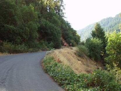Mile 64: Cyclists digging deep on the steep and winding Corkscrew Wall.