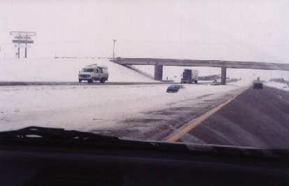 One of the many cars buried under snow along I-80. (30 Jan 2000) One of the many cars buried under snow along I-80.