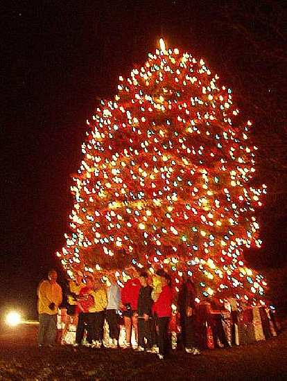 Photo: Our group in front of a big X-mas tree at Woodward Governor (fuzzy photo).