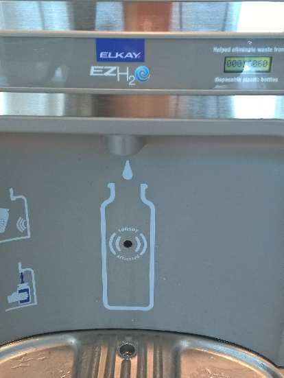 Airports often have water refilling stations.  This one was at the San Jose International Airport.