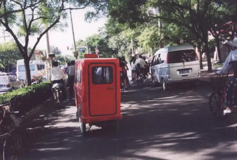 I rented a bicycle for about 50 RMB (US$6)/day and biked through Beijing, often following interesting vehicles like this whatdoyacallit.