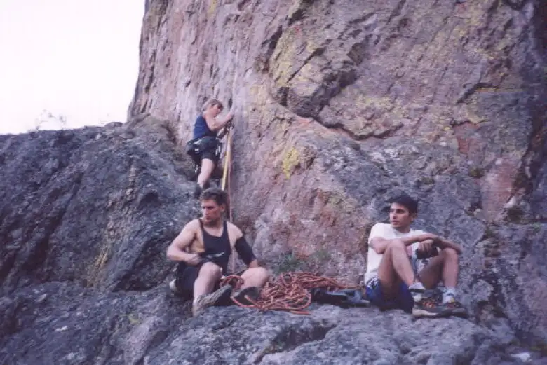 Sharon getting set to lead an extremely painful overhung climb that was likely a 5.12 or 5.13, with Ralf belaying and Iakovos offering comical insights.