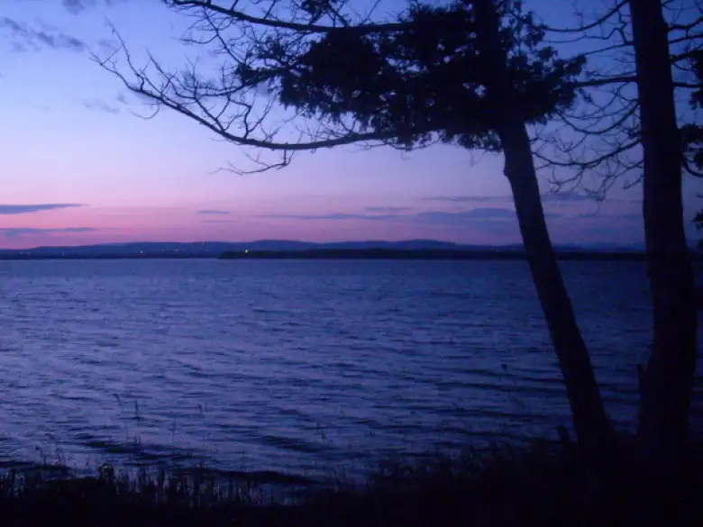 [Mile 435] Pink sunrise over water in Vermont.