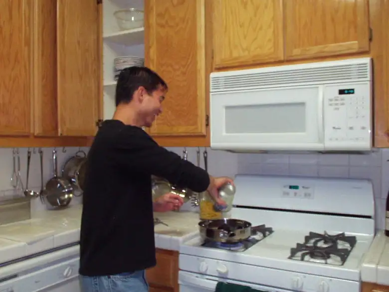 Felix Wong cooking Carolyn dinner the next day, in time for La Noche Espanola...