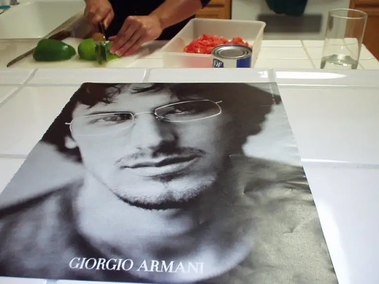 ...but Carolyn seemed to be more impressed by Ethan, winner of Survivor III, in this Giorgio Armani ad instead, for some reason!