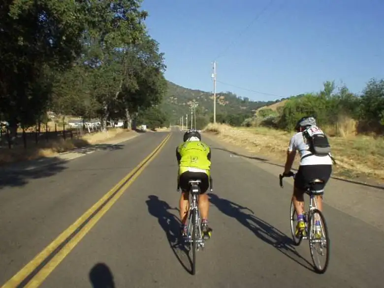 [Mile 33, 7:44 a.m.] At the first rest stop I met John (in yellow) from the SF Tri Club, who knows my friend Lisa Z!  We rode together for much of the Burrough and Tollhouse climbs.