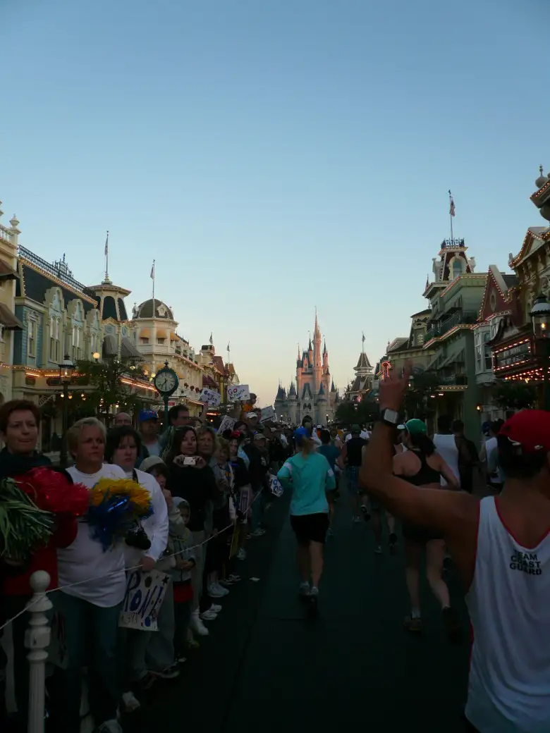 [Mile 10, 7:26 a.m.] Being cheered on by dense crowds before the Magic Kingdom.