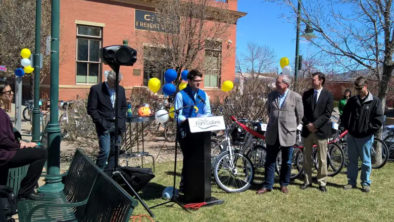 A representative from Zagster giving a speech in downtown Fort Collins. representative from Zagster, Fort Collins Bike Share ceremony