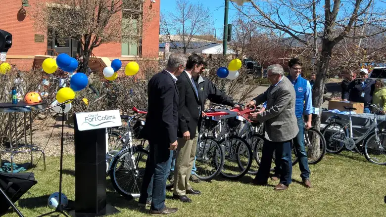 Mayor Wade Troxell cuts a ribbon at the grand unveiling of the Fort Collins Bike Share program. Mayor Wade Troxell cuts a ribbon at the grand unveiling of the Fort Collins Bike Share program.