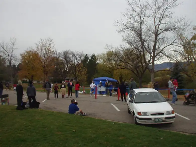 Runners finishing the race among spectators who clearly had the Halloween spirit.