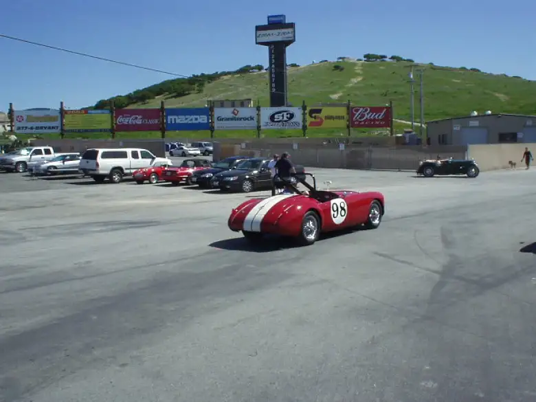 Getting in line was this gorgeous red MGA race car with white racing stripes.