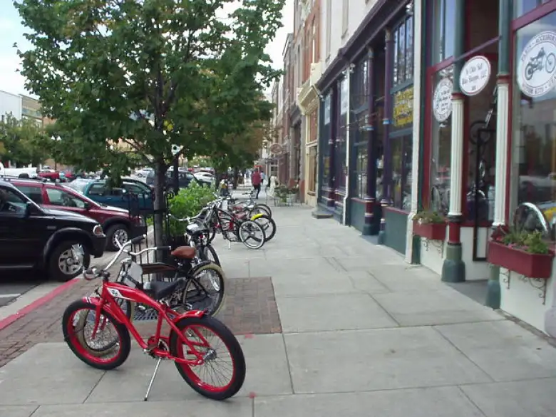 Bicycles downtown in front of a custom motorcycle shop.