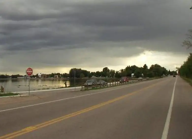 [Mile 205, 7:07 p.m.] Going by a lake in Windsor.  Rain would start falling in another 15 minutes and I'd only get back to the Louisville finish 4 hours later, 2 hours after night had befallen.