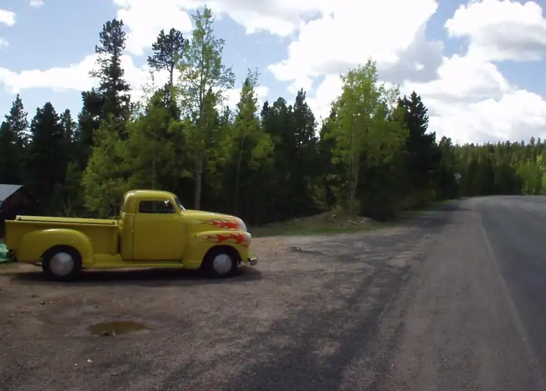 [Mile 90, 10:58 a.m.] The top couldn't come too soon.  There was a nice hot-rodded truck on the Peak-to-Peak Highway.