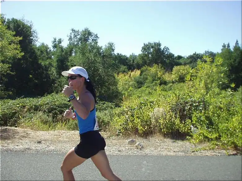 [Mile 10, 1:35 elapsed, 2:05 p.m.] Here's Lisa on the third leg, giving a thumbs up.  By this time it was really roasting outside, and she still did great.