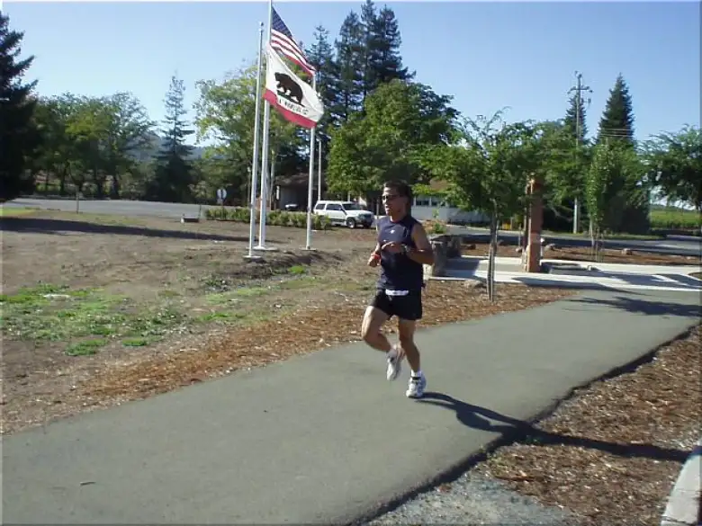 [Mile 23, 3:07 elapsed, 3:37 p.m.] Here's Mike running underneath the stars and stripes and the California flag.