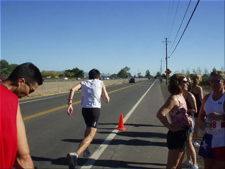 [Mile 26, 3:35 elapsed, 4:05 p.m.] Here's Everitt taking off right after grabbing the baton (actually an elastic wrist band) from Mike.