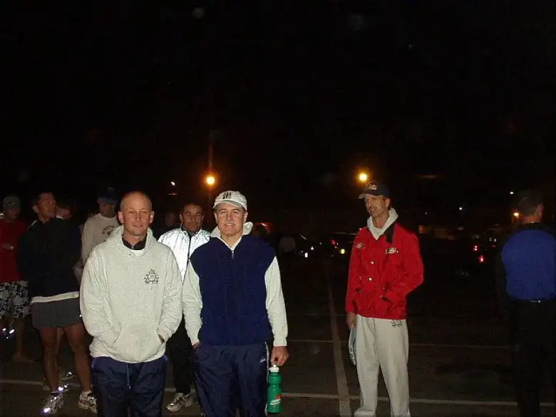 [Mile 105, 14:19 elapsed, 2:49 a.m.] After we in Van #1 ran our 2nd legs, we met the other van at the van exchange just south of the Golden Gate Bridge.  Here's Tom, Al (background), Phil, and Steve during a beautiful night of a full moon and perfect running temps.