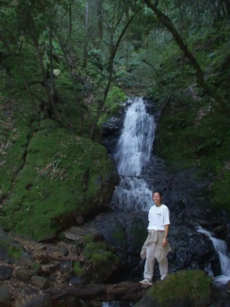 Evelyn in front of another waterfall.