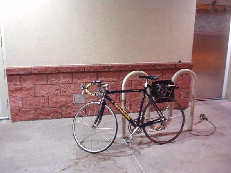 Carrie with her new tires during a nighttime commute ride.