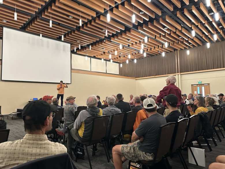 An audience member named David told how he was an extra in the movie. He wore a red shirt to try to be more identifiable during a two-second flyover during the movie.