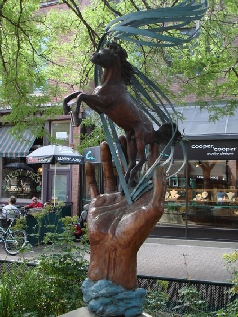 A horse on a hand in Old Town Plaza.