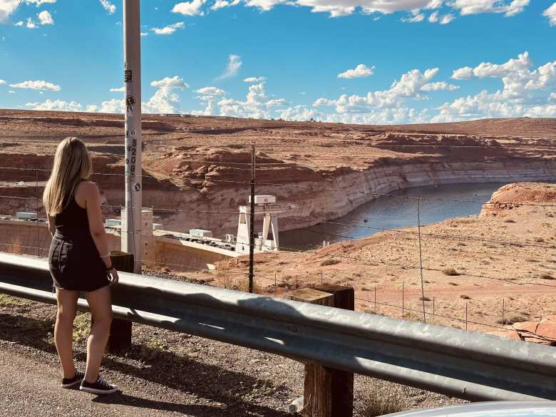 Andrea standing on Navajo Sandstone at Horseshoe Bend.