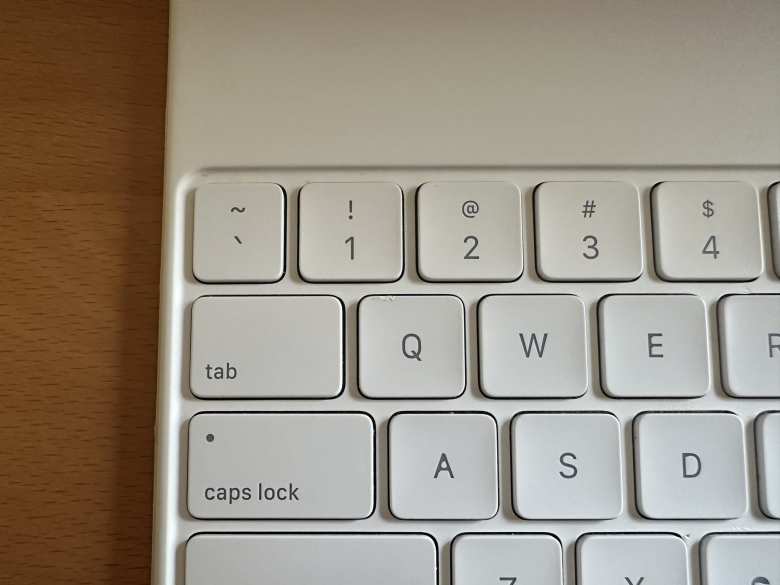 About three millimeter's worth of paint had chipped off from the 'Q' key on my white Apple Magic Keyboard. Here's how the repaired key looks a month after the repair. While not perfect, in real life, it is unnoticeable to my eye and is a huge improvement over the chipped paint.
