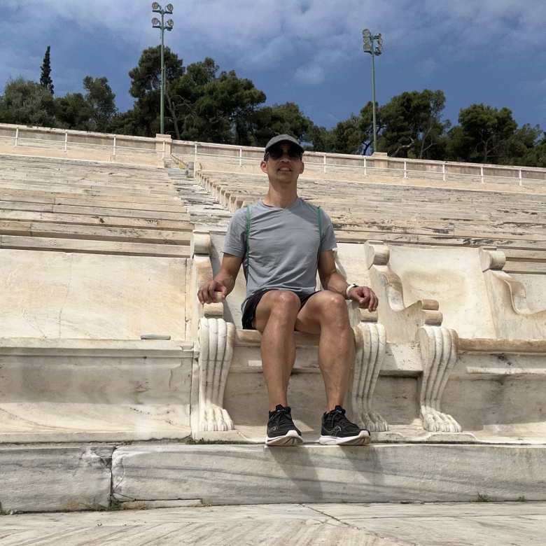 Felix sitting on one of the royal thrones at the Panathenaic Stadium.