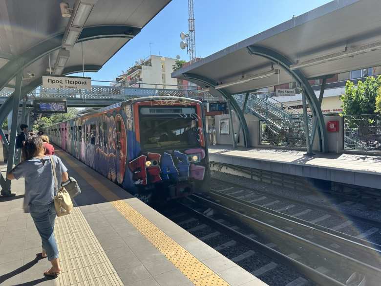 The trains in Athens were covered in colorful graffiti.